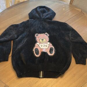 Black Fuzzy jacket with a cute bear on the back